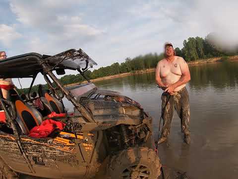 washing out the radiator of Teryx after playing in the mud