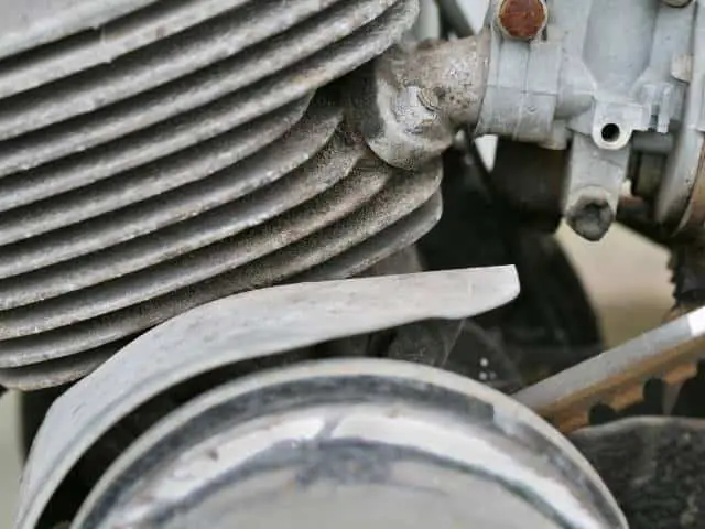 Mechanic Checking Car Engine For Leaks